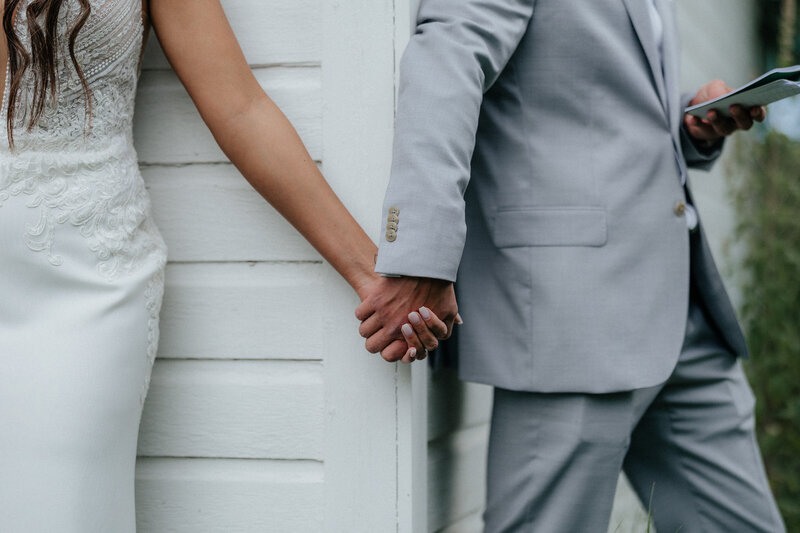 Denver Wedding Photographer captures bride and groom holding hands