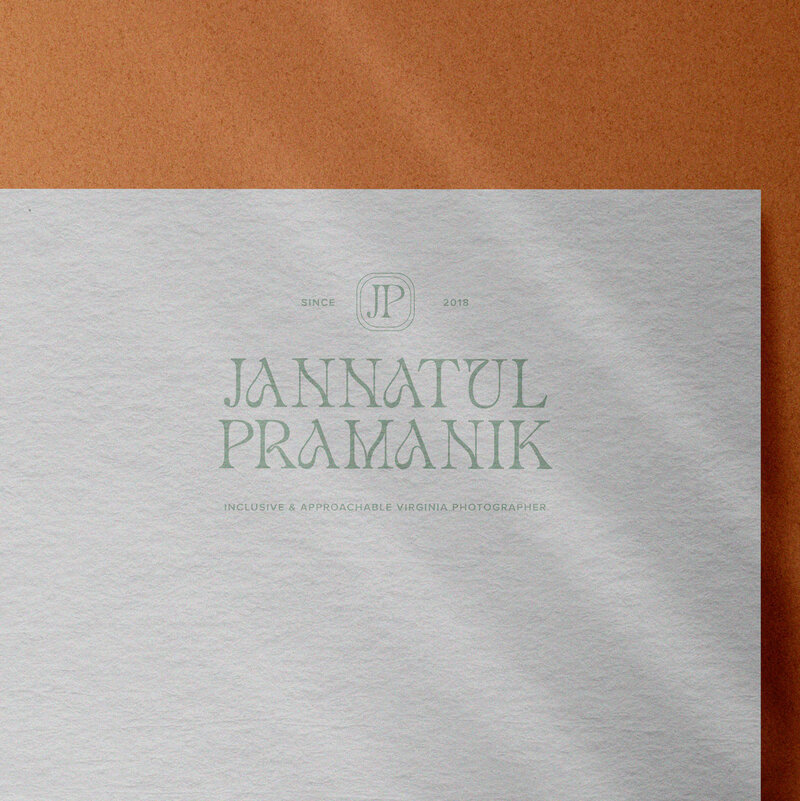 A logo for Jannatul Pramanik printed on the top of a piece of paper