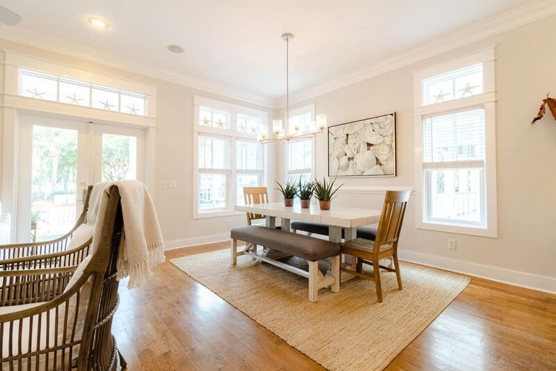 white dining table with bench seating