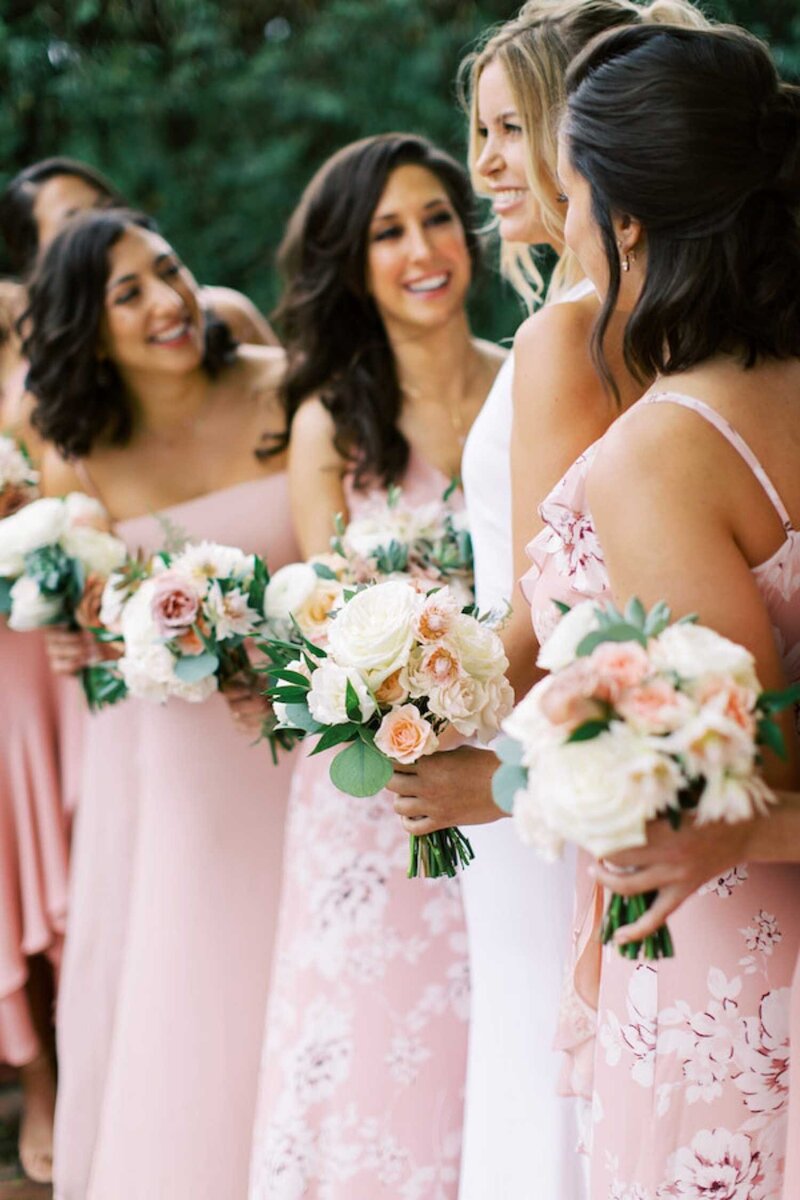 Bride and Bridesmaids with Patterned dresses and Flowers