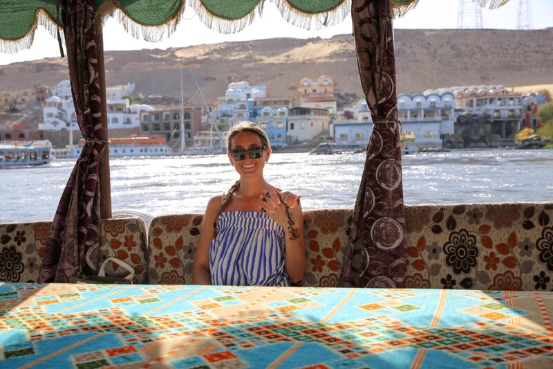 Man walking in dusty road lined with Baobob trees