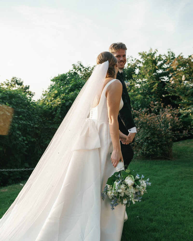 Bride and Groom with blue and white wedding bouquet at the metal museum by memphis wedding photographer bethany reid visuals