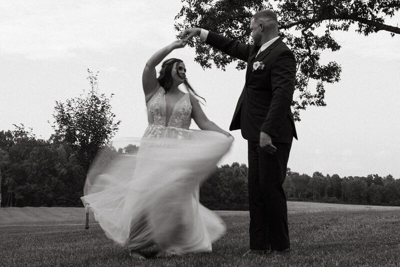 black and white blurred motion wedding photo of couple
