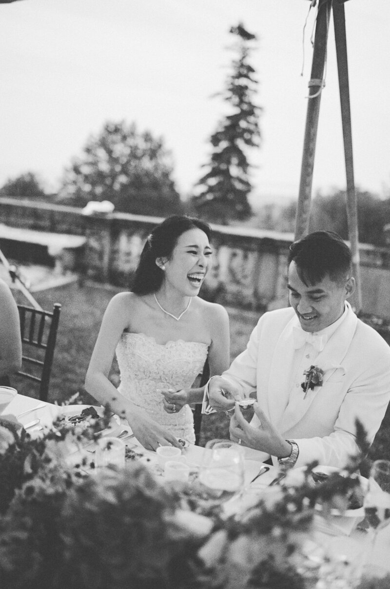 couple laughs during wedding reception at Crane Estate in Ipswich Massachusetts taken by boston documentary wedding photographer