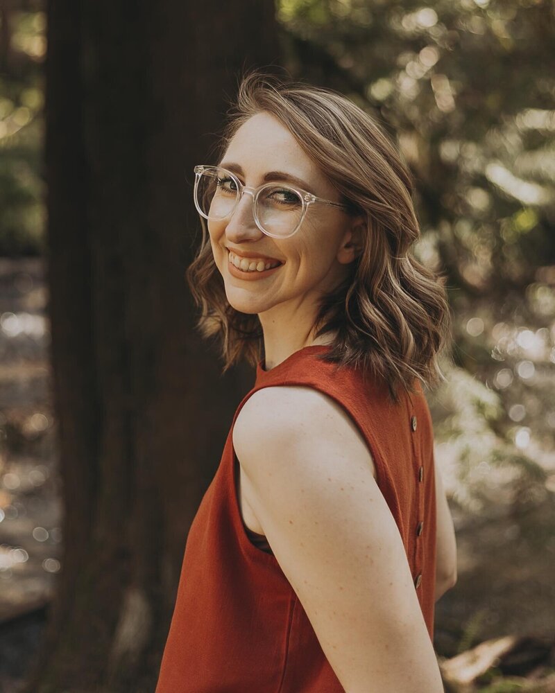 woman standing in forest