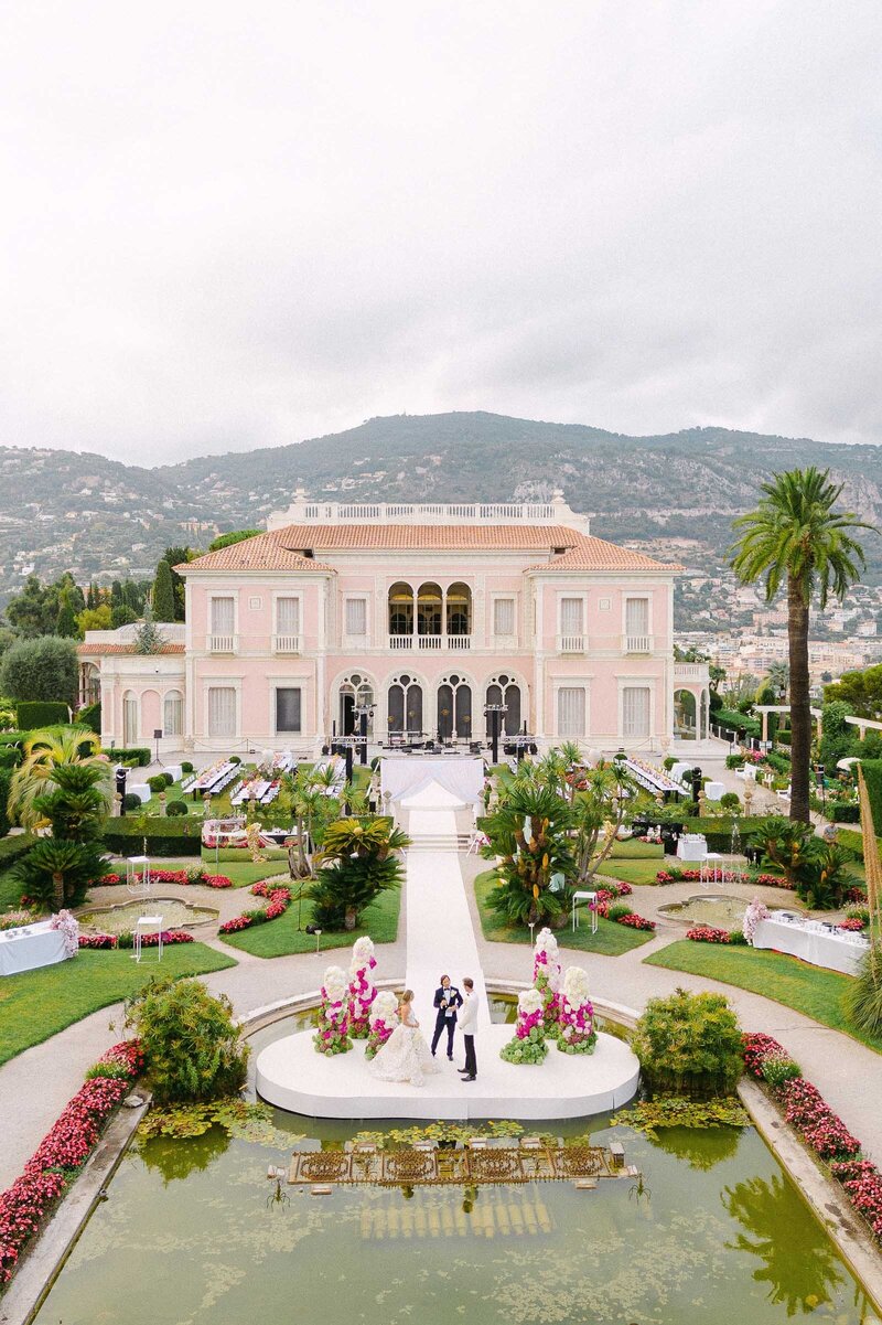 Drone image of luxurious ceremony in Villa Ephrussi gardens.