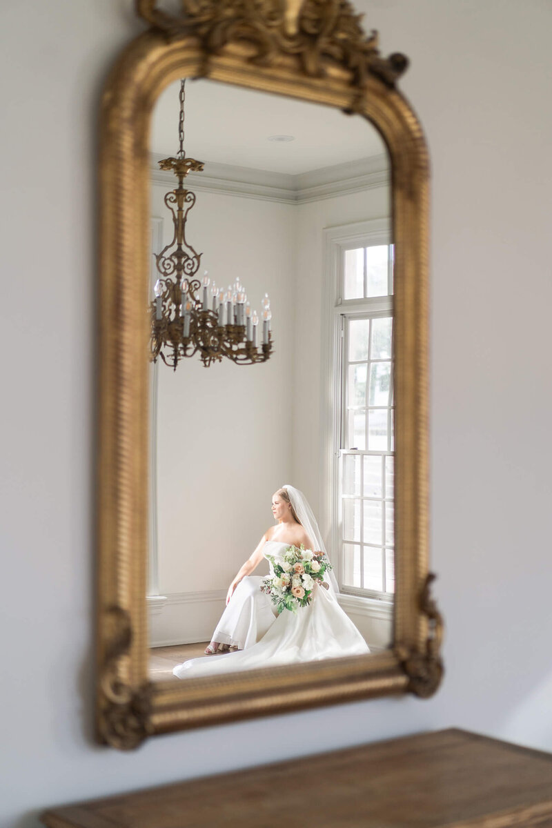 Houstons best wedding photographers Swish and Click Photography Houston bride sits during her bridal session