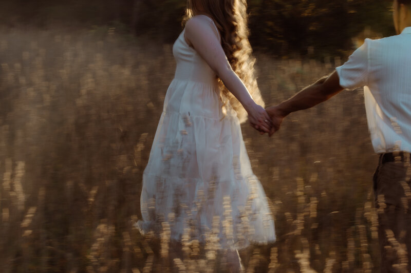 engagement photo in field documentary-style wedding photography