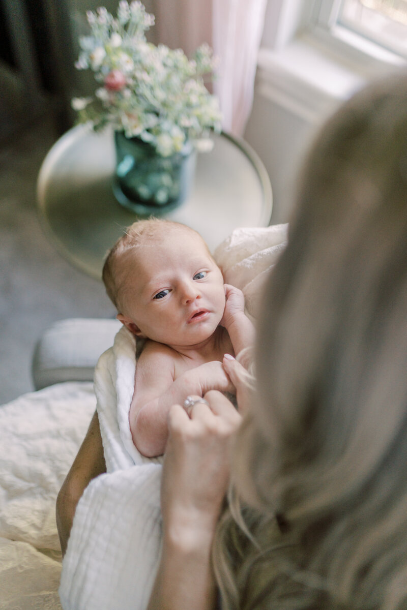 Mom laying on bed with baby by Lawton Ok Photographer