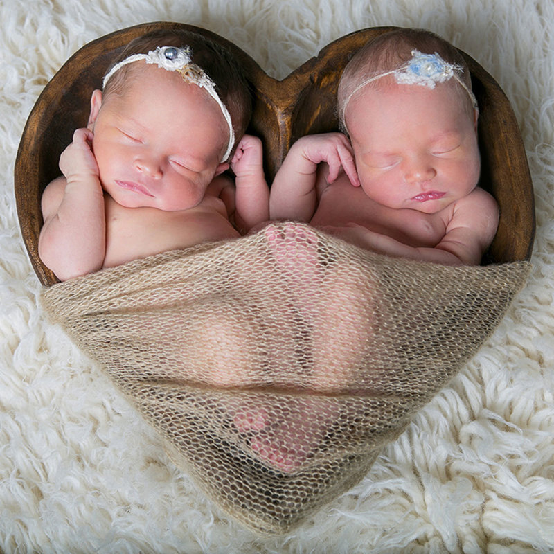 Newborn girl sleeping during studio photoshoot