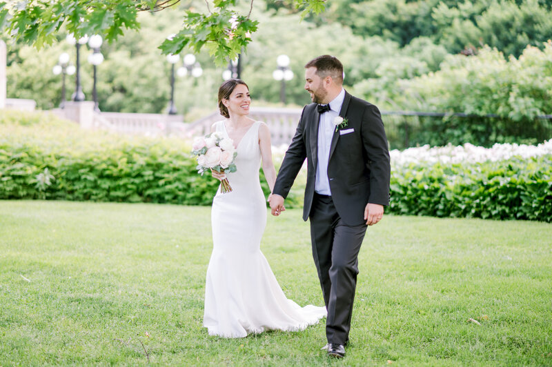 Bride and groom walk up memorial steps at their DC wedding