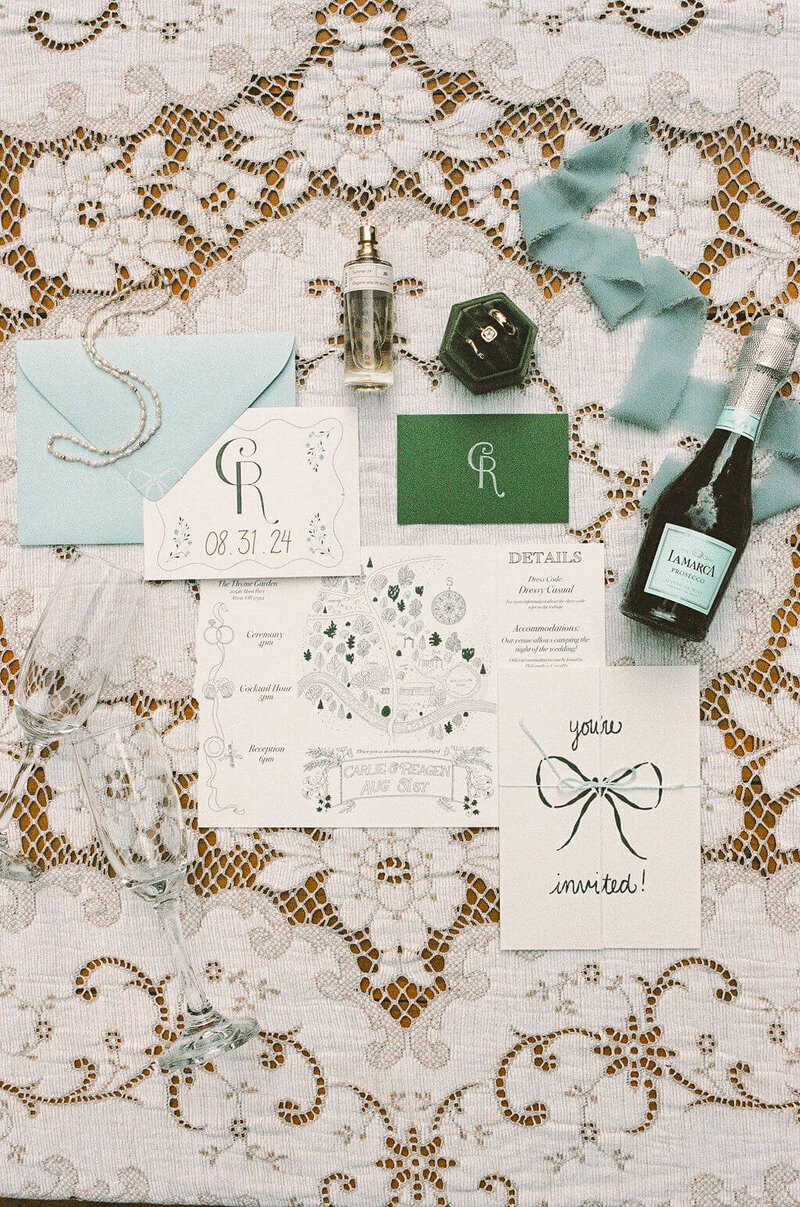 A flat lay of wedding details from a wedding planned by Birdie June,  wedding and event planners in Oregon