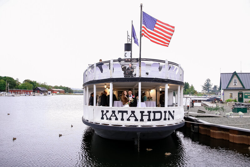 Bride and Groom standing on Katahdin boat together | Wedding Photography