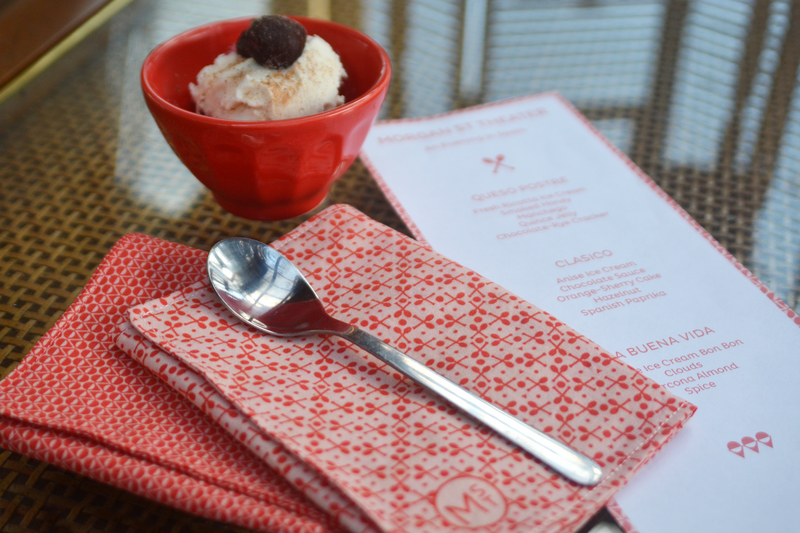 Custom designed table linens for Morgan Street Theater by Skye McNeill. Image shows two folded napkins in two different ice cream themed prints and the logo, along with matching menus, a spoon and ice cream.