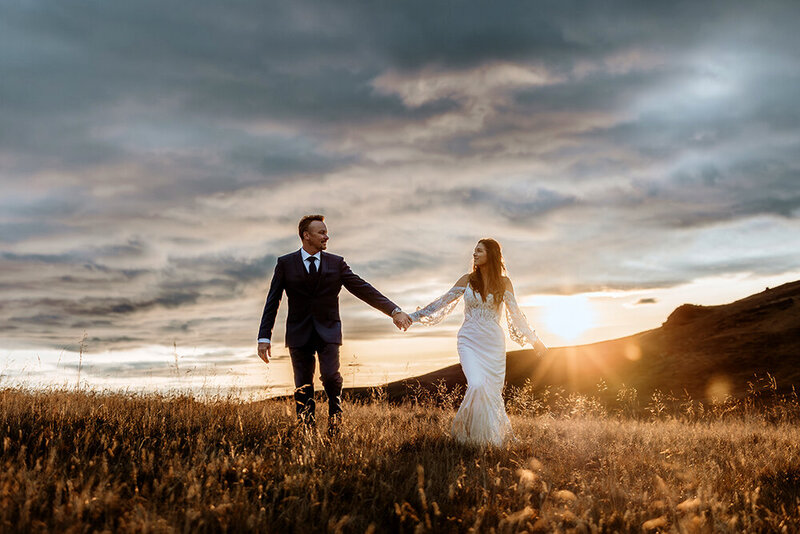 Married couple is having a photoshoot during sunset in Iceland