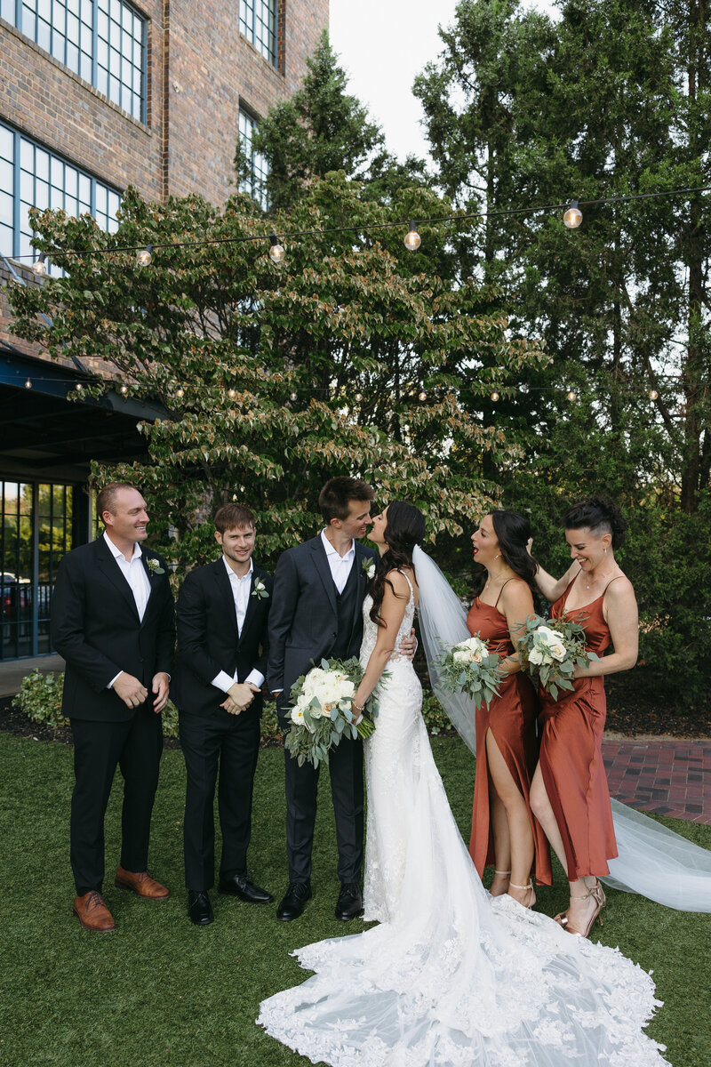 A joyful wedding party cheers for the newlyweds, celebrating a perfectly planned day. Girasole & Co. Weddings—Columbus, Ohio’s trusted wedding planner—specializes in stress-free, beautifully curated weddings for engaged couples. Let us bring your vision to life with expert coordination and personalized planning.