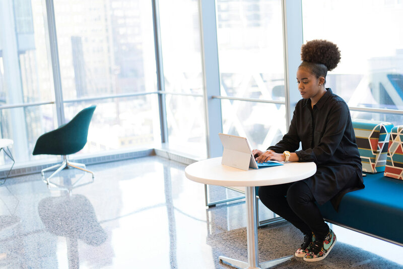 A young entrepreneur works at a table.