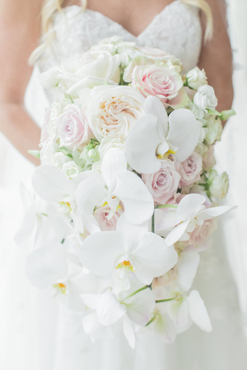 close up of a bride holding a flower bouquet