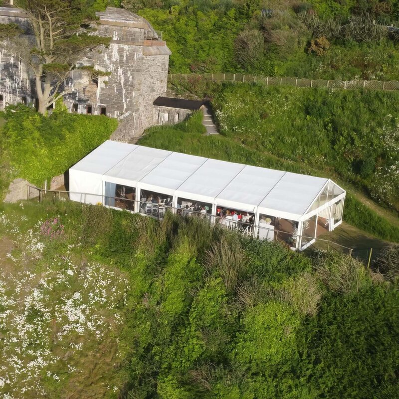 A large white marquee sat in front of the fort