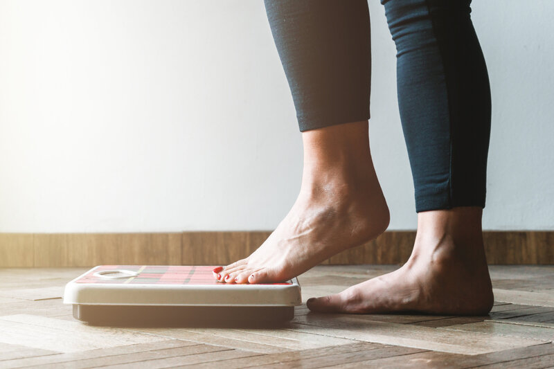 woman's feet on scale