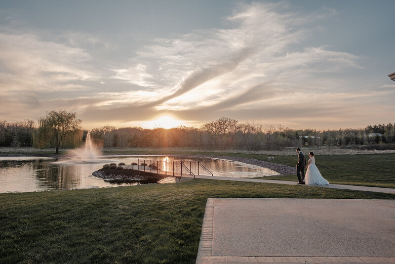 wedding couple embracing for kiss