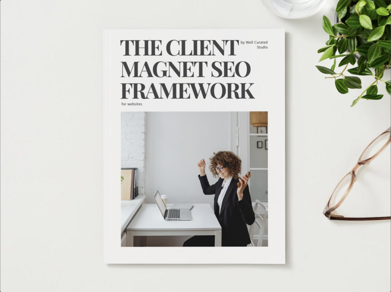 Cover of The Client Magnet SEO Framework workbook for websites, created by Well Curated Studio featuring a businesswoman celebrating success at her desk.