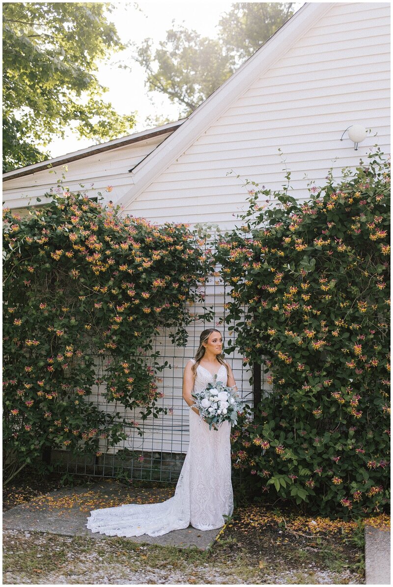 bride with hat holds bouquet in gatlinburg tn elopement package