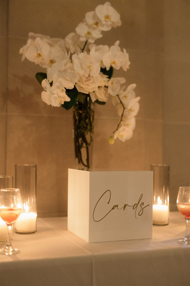 Wedding card box with candles and white orchids