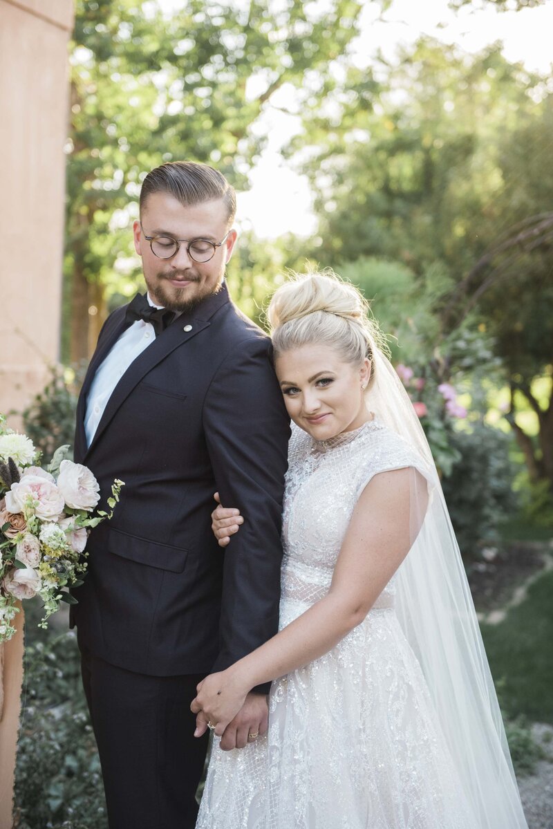 Bride and groom pose on their wedding day