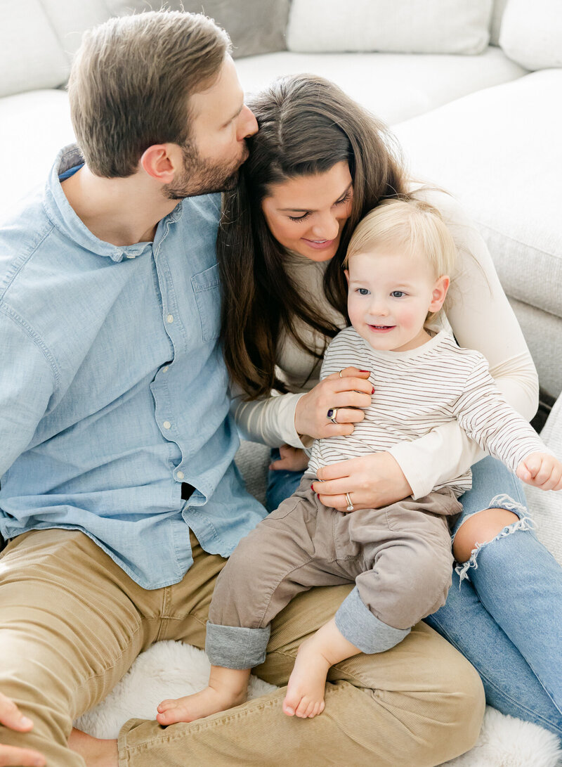 Family snuggling comfortably in their home during their in home session with Indianapolis family photographer Brittney Lear Photography
