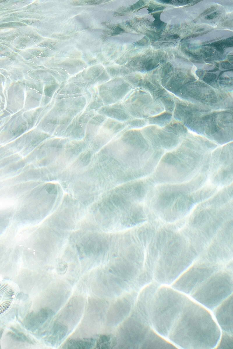Light blue water surface glittering in the light