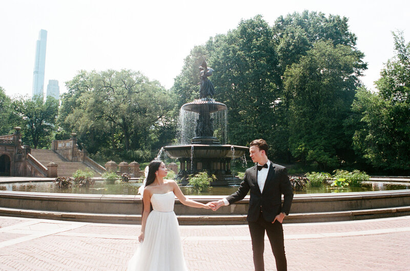 newlyweds holding hands in central park