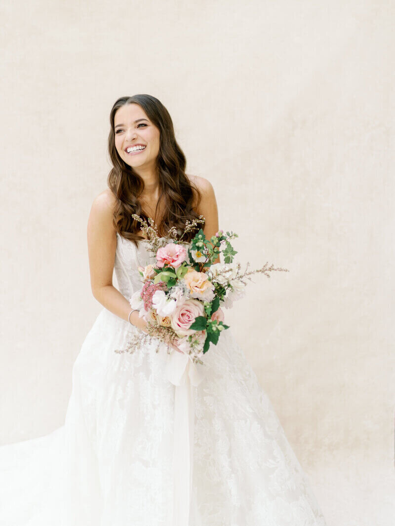 Bride holding floral bouquet by event planners in chicago area