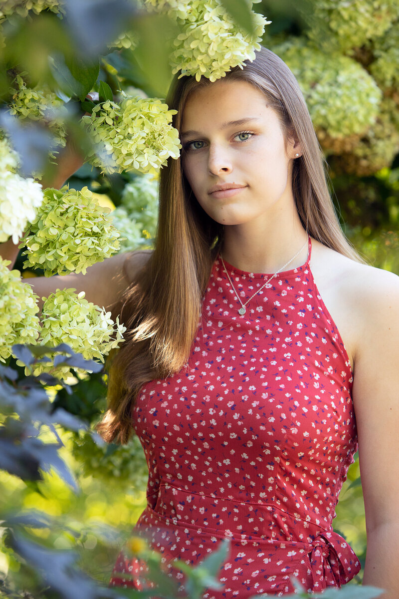 high school senior girl in flowers