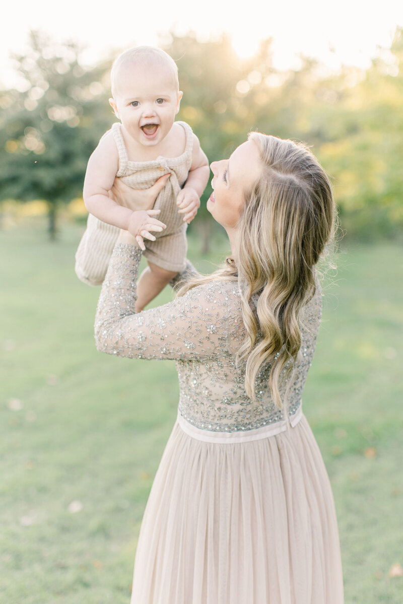 First birthday family photo of mom  in Needle and Thread dress.