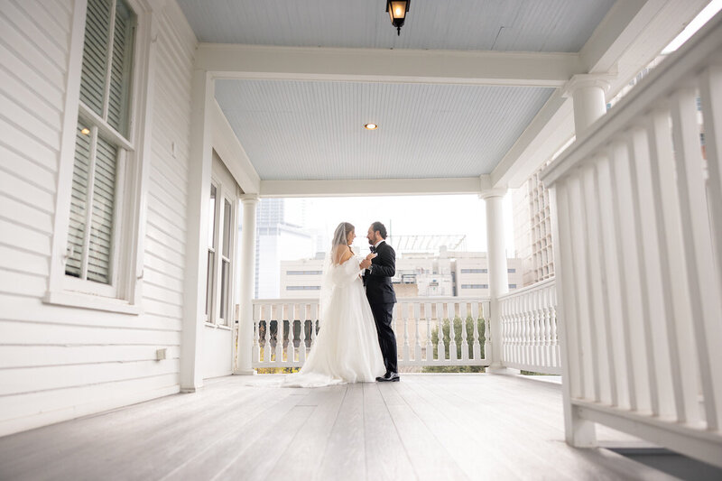 Golden hour couples portraits in front of historic Victorian home at The Allan House
