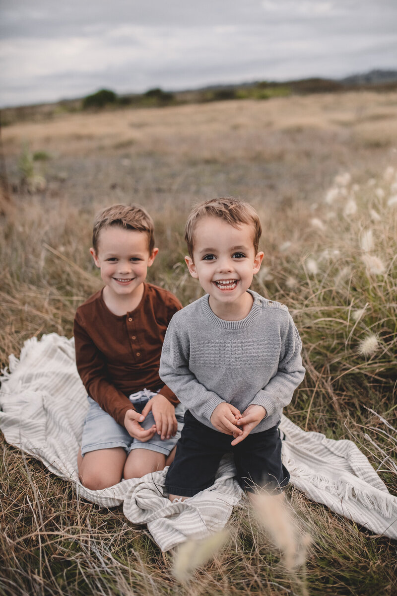 Two boys stading for photographer in Hawkes Bay
