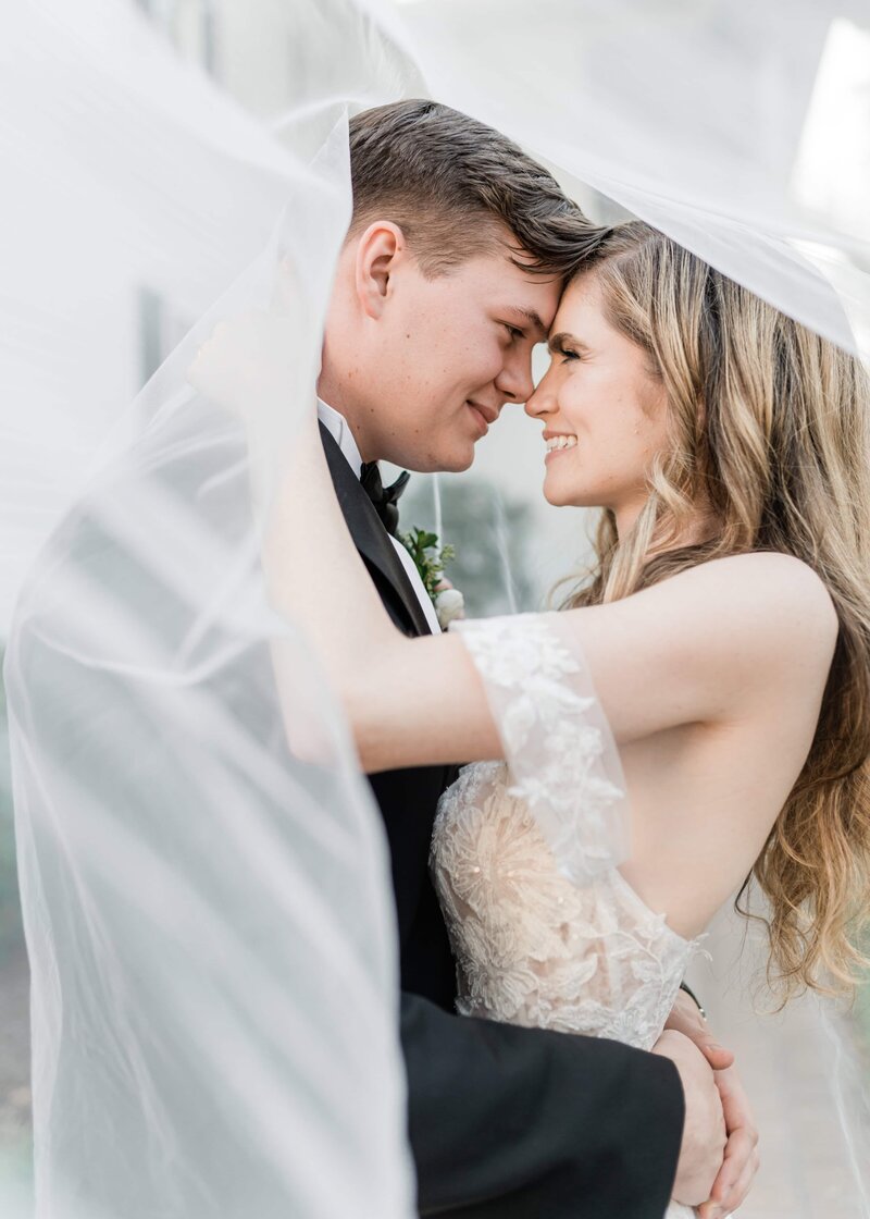 bride and groom forehead to forehead at the beaufort inn