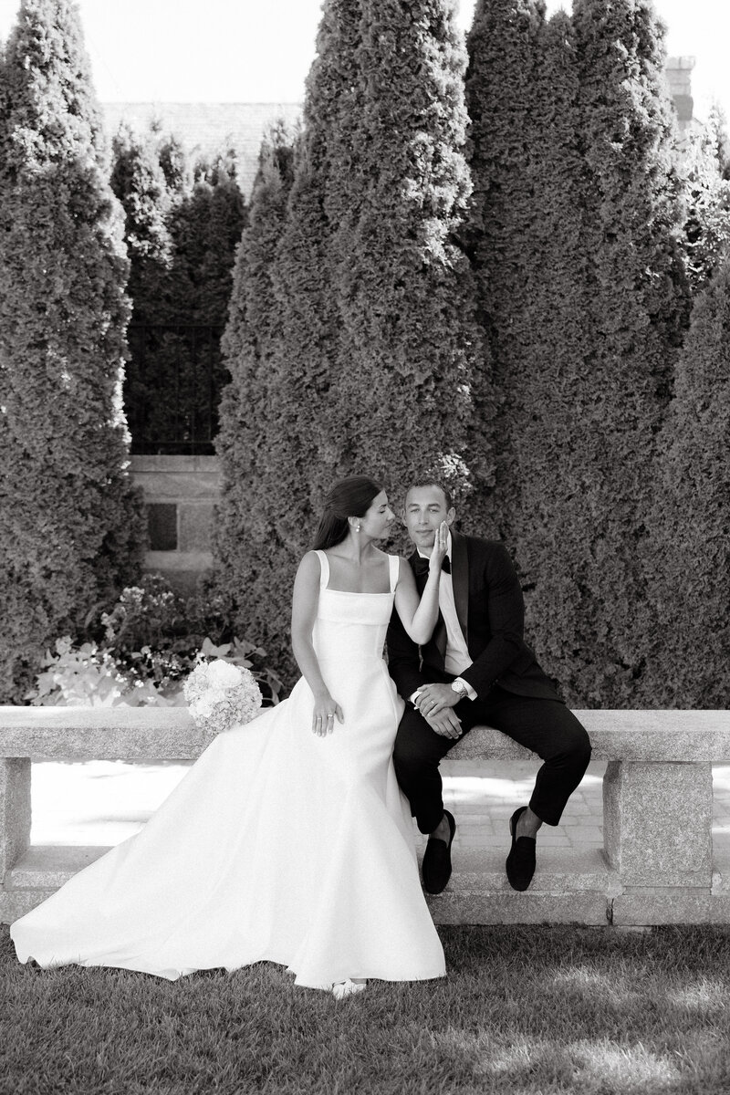 Photo of bride and groom smiling at each other and embracing taken by Maine wedding photographer