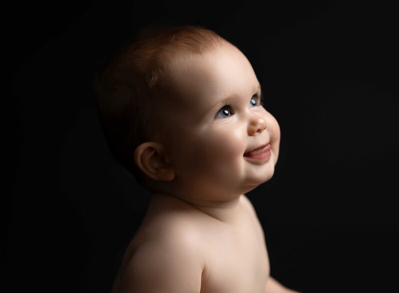 Closet up of baby to show her blue eyes. Professional portrait taken by Jenni Nikki at Baby photo studio near Atlanta.