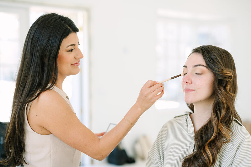 Makeup artist applying makeup