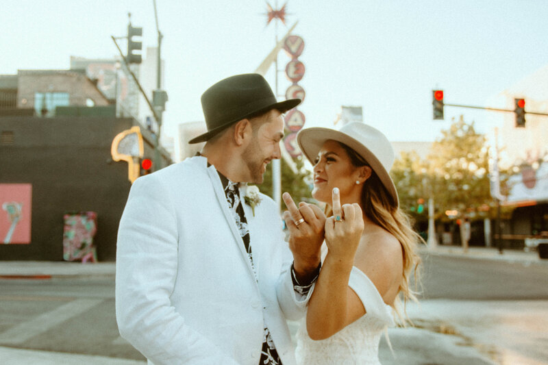 Colorado couple eloping in downtown Las Vegas, Nevada on Fremont East District wearing wedding bands from RAW by Olivia Mar