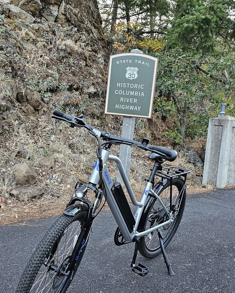 Reminisce about the past as you pass by the historic Columbia River Highway Sign, Route 30, with The Gorge E-Bike Adventure Rentals