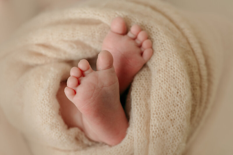 Newborn Photography San Diego, a photo of two newborn feet