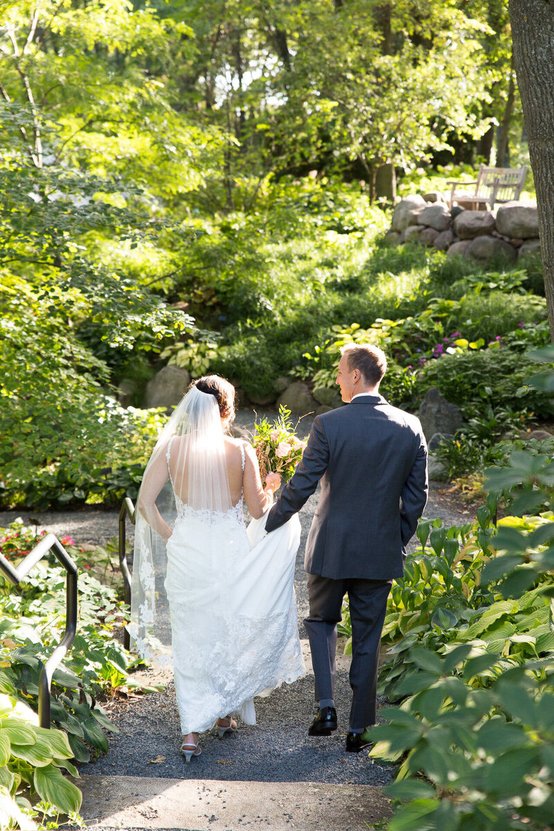 bride and groom kissing at the green bay botanical gardens