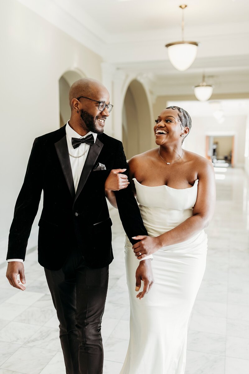 Louisville wedding photographer captures candid, joyful newlywed moments at the Louisville Free Public Library.