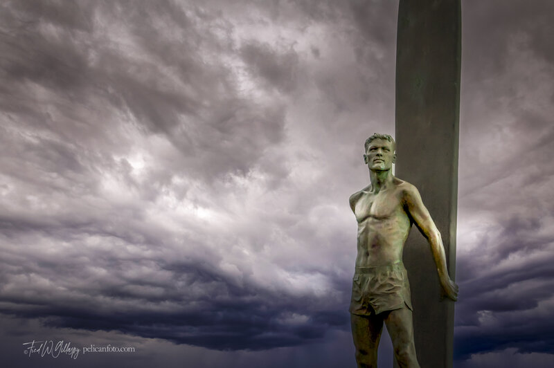 World-renowned surfing monument statue at surfing destination Steamer Lane in Santa Cruz, California.