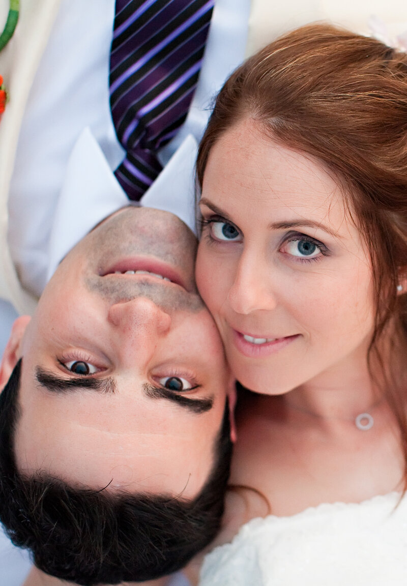 Image of Brian Sellers, a wedding videographer in Williamsburg, VA, and his wife, looking in love and smiling on their wedding day