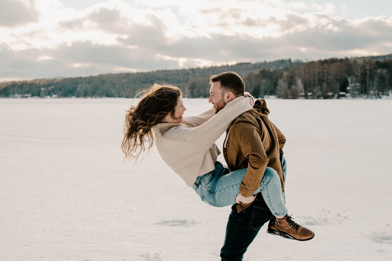 Snowy Engagement Session couple dancing in the snow