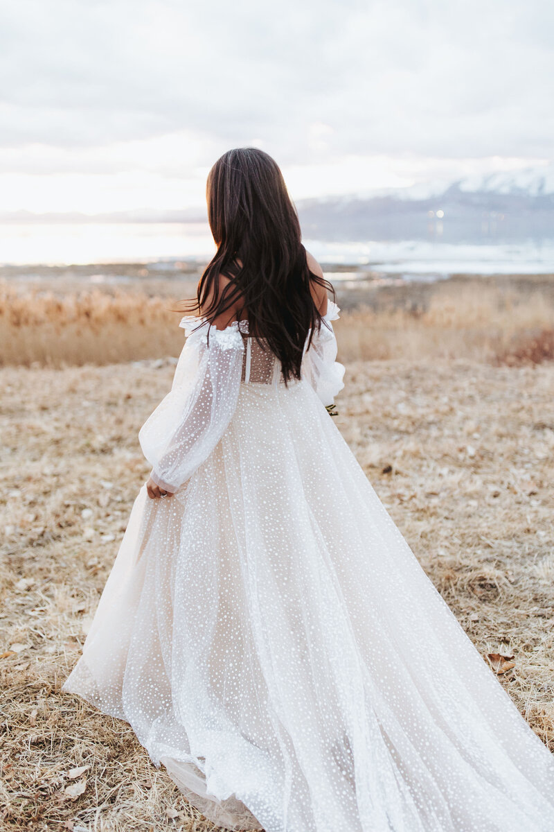 bride standing in field